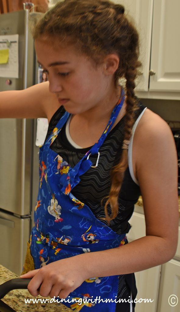 Young girl in apron cooking Can you slice, dice and whip it good? www.diningwithmimi.com